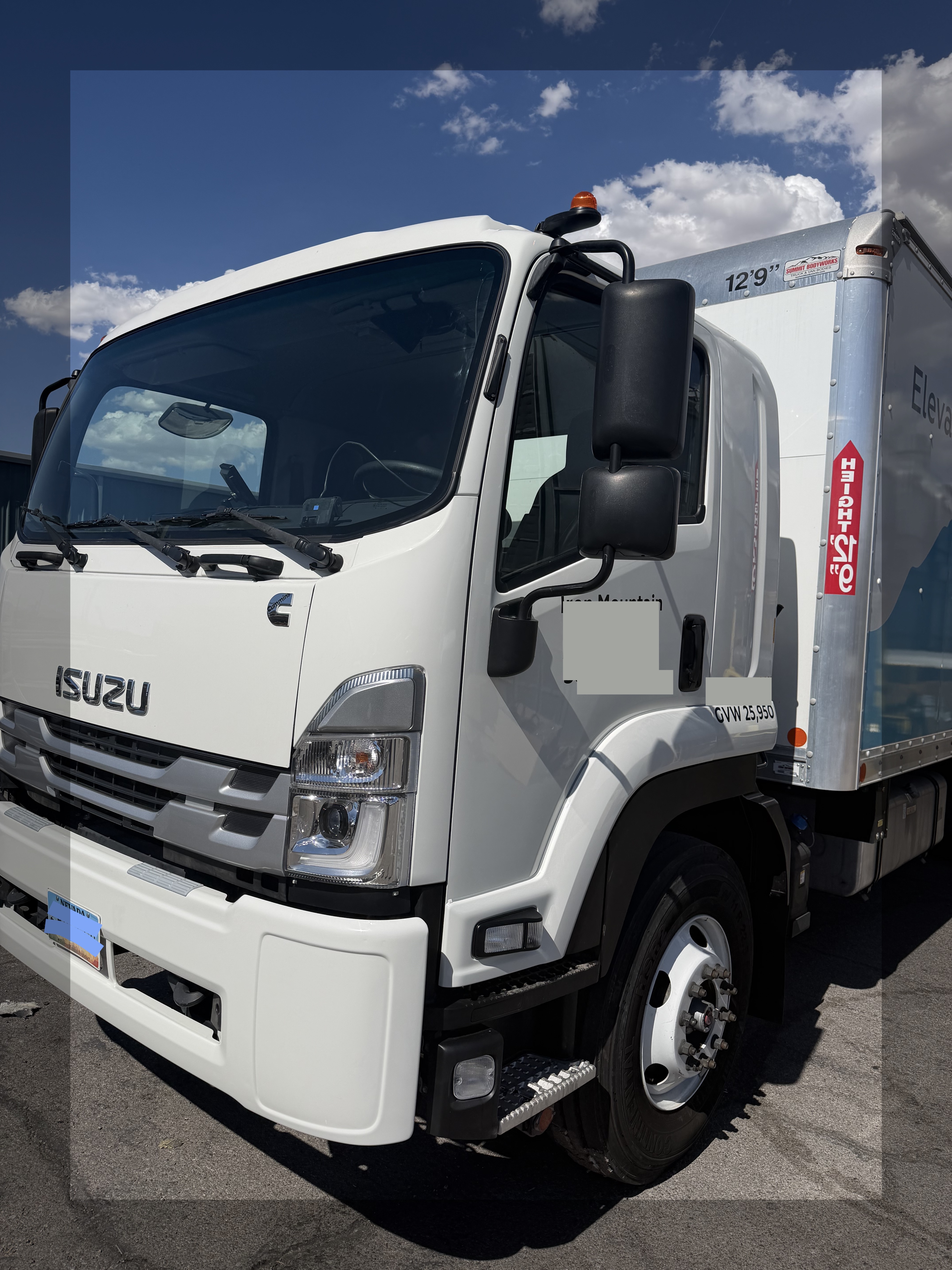 Isuzu FTR HD box truck after heavy-duty structural collision repair in Las Vegas